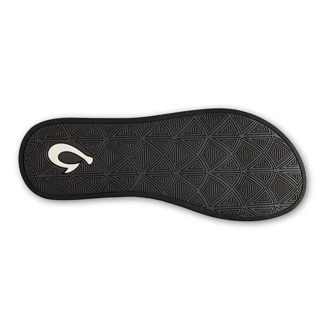 Sole of a White Women's Olukai Puawe Flip Flop with a black sole and black tread