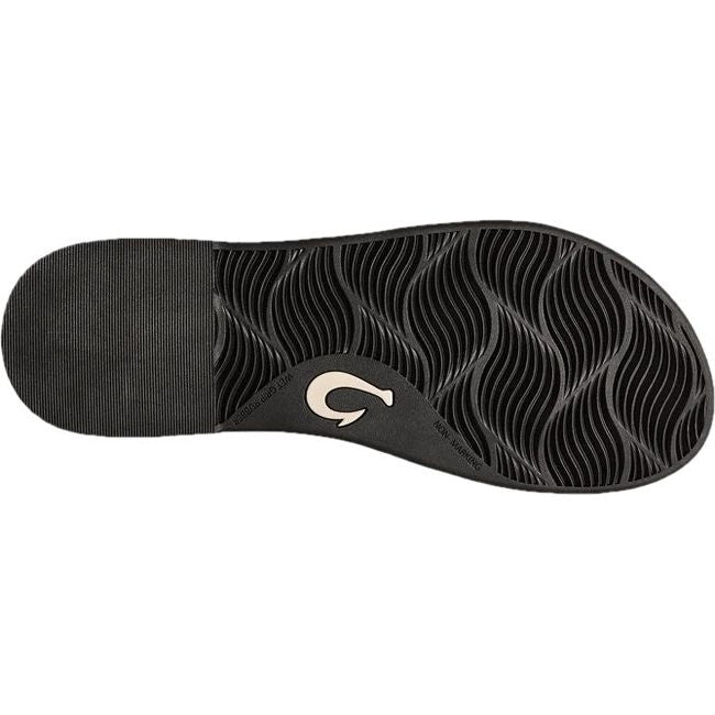Sole of Women's Olukai La'i T-Bar Sandal in Lava Rock Black