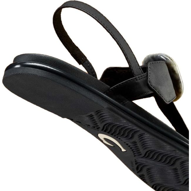 Sole and heel close up of Women's Olukai La'i T-Bar Sandal in Lava Rock Black with backstrap