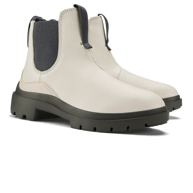 Pair of womens Olukai Hehi Waterproof Boot. White leather, elastic side panels, durable gray sole
