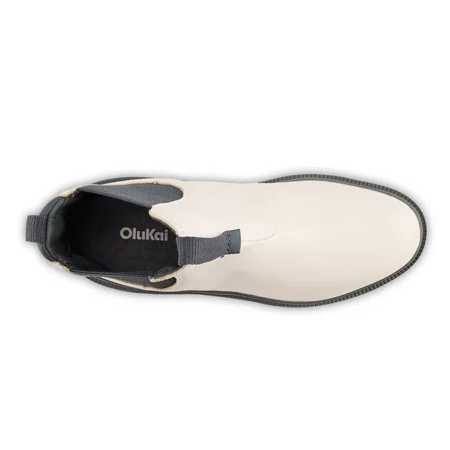 Pair of womens Olukai Hehi Waterproof Boot. White leather, elastic side panels, durable gray sole