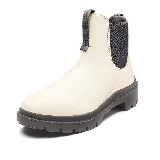 Angled front of womens Olukai Hehi Waterproof Boot. White leather, elastic side panels, durable sole