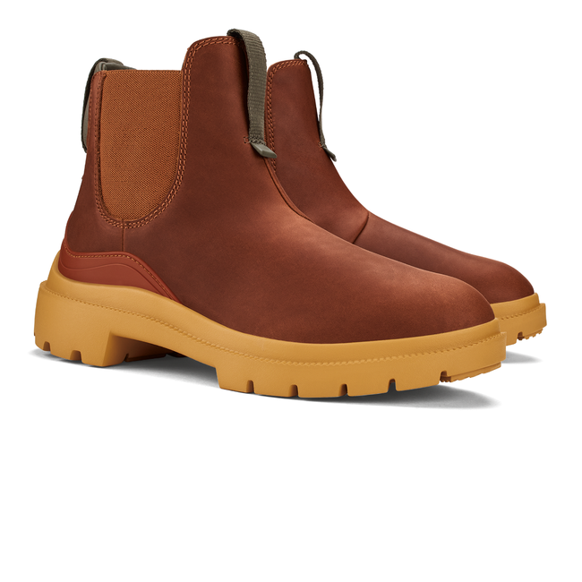 Pair of womens Olukai Hehi Waterproof Boot. Brown leather upper, elastic side panels, durable sole