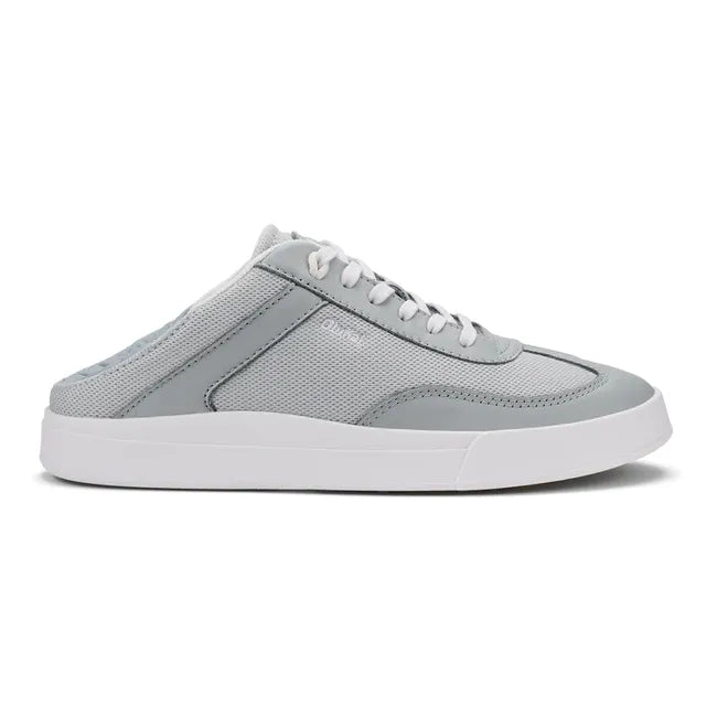 Lateral side of Olukai Haupu Hulu Sneaker in grey with the drop down heel down for easy slip on