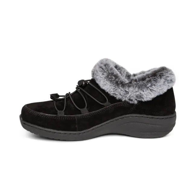 Medial side of Aetrex Women's Chrissy Bootie in Black Suede woth faux fur