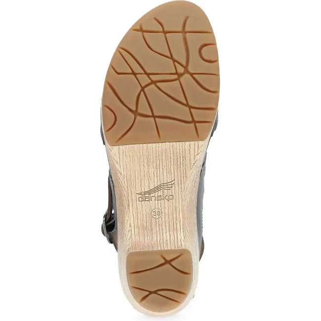 Sole of Women's Dansko Lucia Closed Toe Sandal in navy leather upper with tan sole and tread