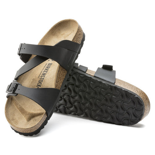 A pair of black Birko-Flor Birkenstock Salina. One shows the sole and the other shows the upper.