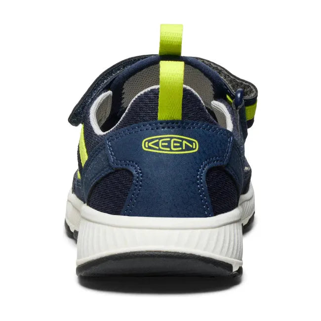 Heel of KEEN Big Kids' Motozoa Closed Toe Sandal in Naval Academy blue Evening Primrose yellow