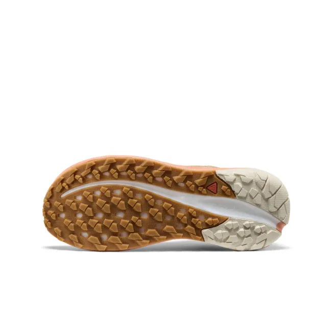 Sole of KEEN Women&#39;s Roam Trail Running Shoe in taupe and orange