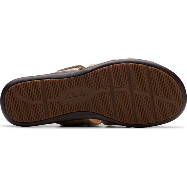 Sole of Women&#39;s Clarks Kitly Slide Sandal in Metallic Leather with brown tread