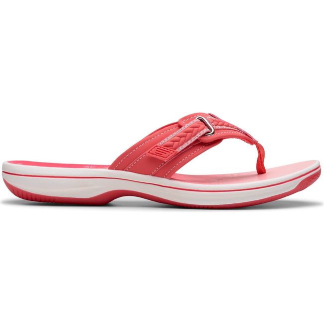 Lateral side of Women&#39;s Clarks Breezy Sun Flip Flop Sandal in Bright Coral Pink with velcro strap