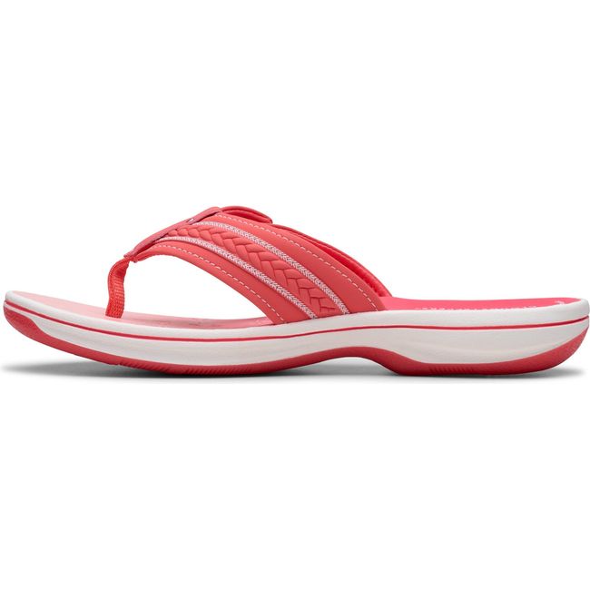 Medial side of Women&#39;s Clarks Breezy Sun Flip Flop Sandal in Bright Coral Pink with velcro strap