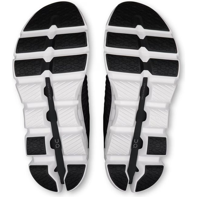 Soles of Women's On Running Cloudswift 4 Running Shoes in Black and White with hollow cloud pods