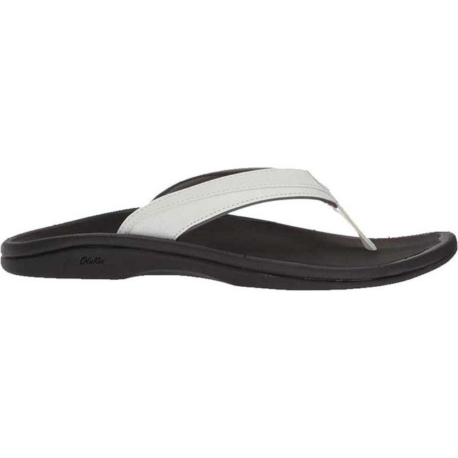 Lateral side of Women's Olukai ‘Ohana Flip Flop in white leather and black sole