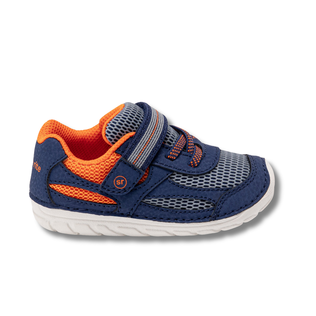 Lateral side of Stride Rite Kids' Soft Motion Turbo 2.0 Sneaker in Navy, Grey, and Orange
