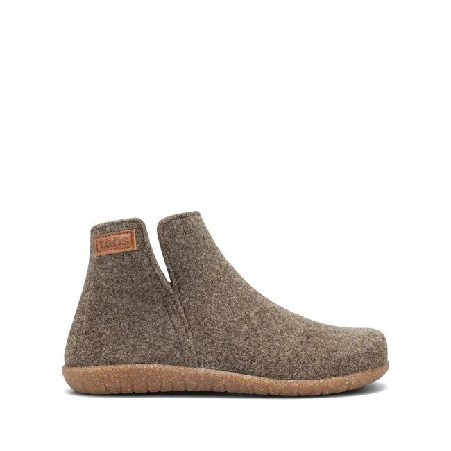 Lateral side of slip on Women's Taos Good Wool Slipper Boot in brown olive wool