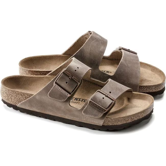 Pair of Birkenstock Unisex Arizona Oiled Leather Sandals in tobacco brown