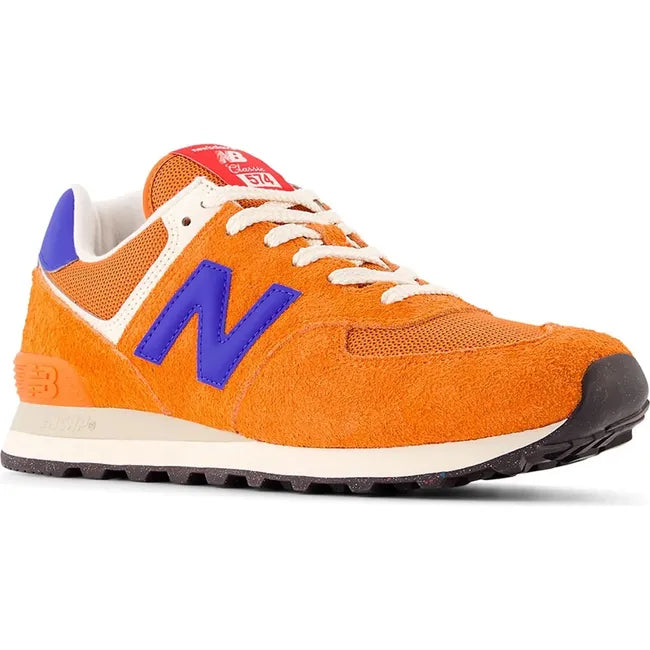 Front angled view of Unisex New Balance 574 Lifestyle Shoe in Sienna Orange