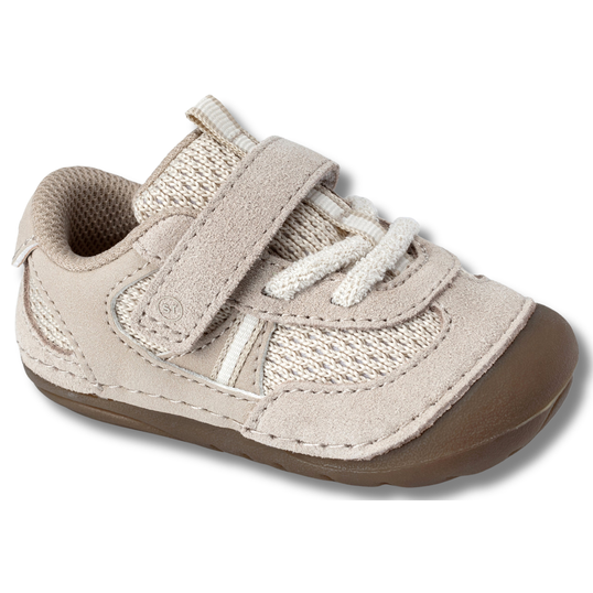 Angled side of Stride Rite Kids' Soft Motion Jules Sneaker in Toffee Beige