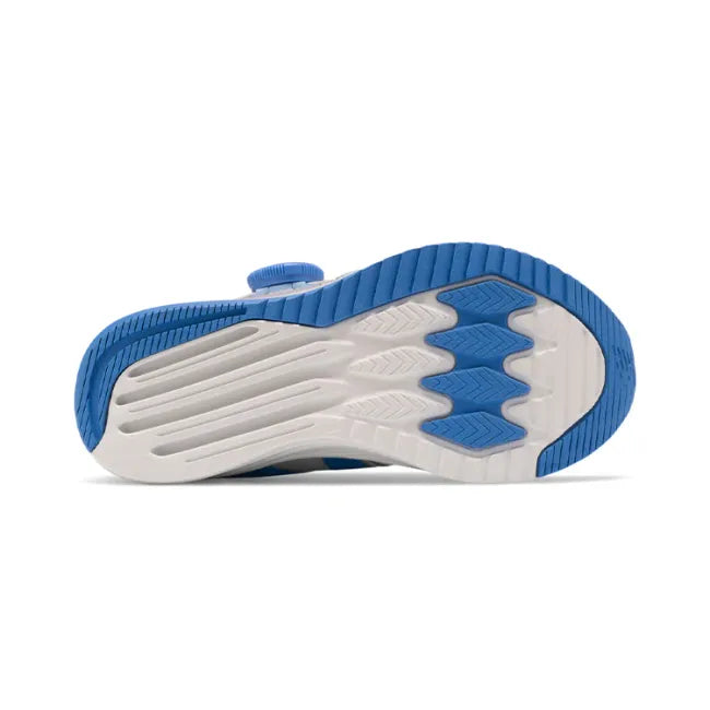 White sole of New Balance Kids' FuelCore Reveal BOA Running Shoe in light aluminum, pink, and blue