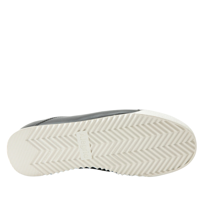 White sole of Alegria Women's Reah Slip On Shoe in black leather