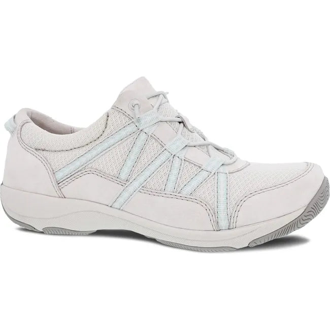 Front angled view of Women's Dansko Harlyn Sneaker in ecru suede with elastic laces