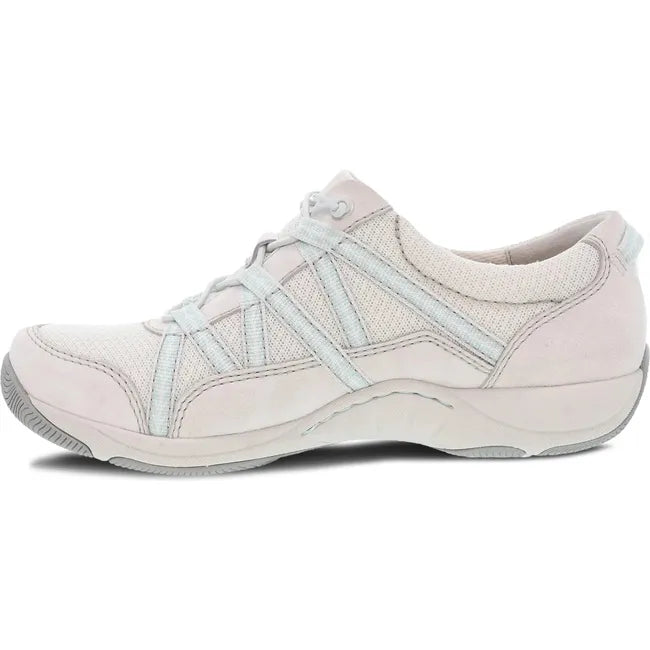 Medial side of Women's Dansko Harlyn Sneaker in ecru suede with elastic laces