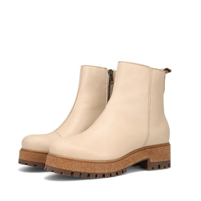 Pair of Women's Taos Downtown Boot in ivory leather with cork midsole and side zipper