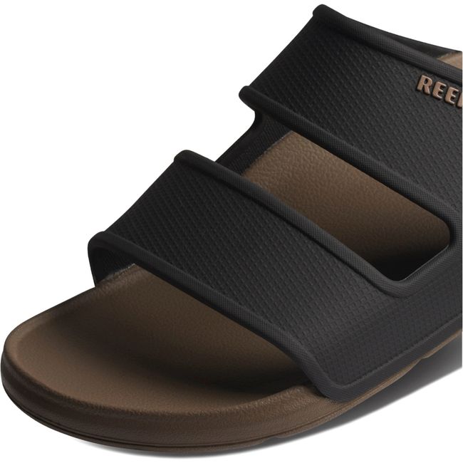 Close up of Men's Reef Oasis Double Up Slide Sandal in Fossil brown and Black