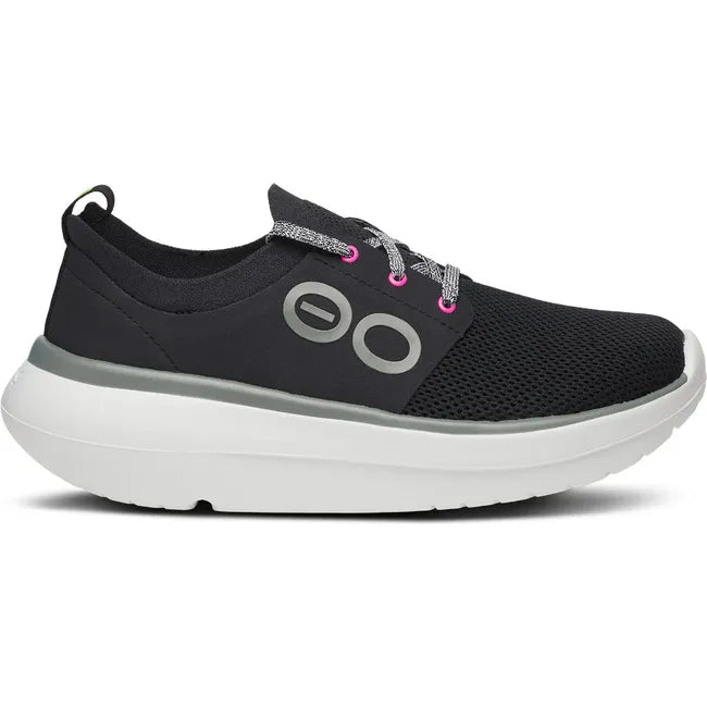 Lateral side of Women's OOfos OOmy Stride Shoe in Black and White