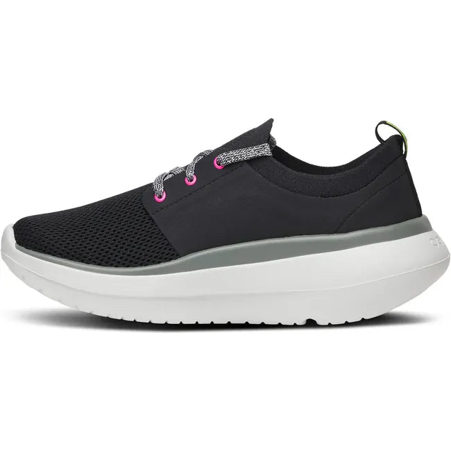 Medial side of Women's OOfos OOmy Stride Shoe in Black and White