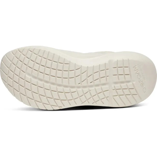 White sole of Women&#39;s OOfos OOmy Zen Sneaker in Chalk off white