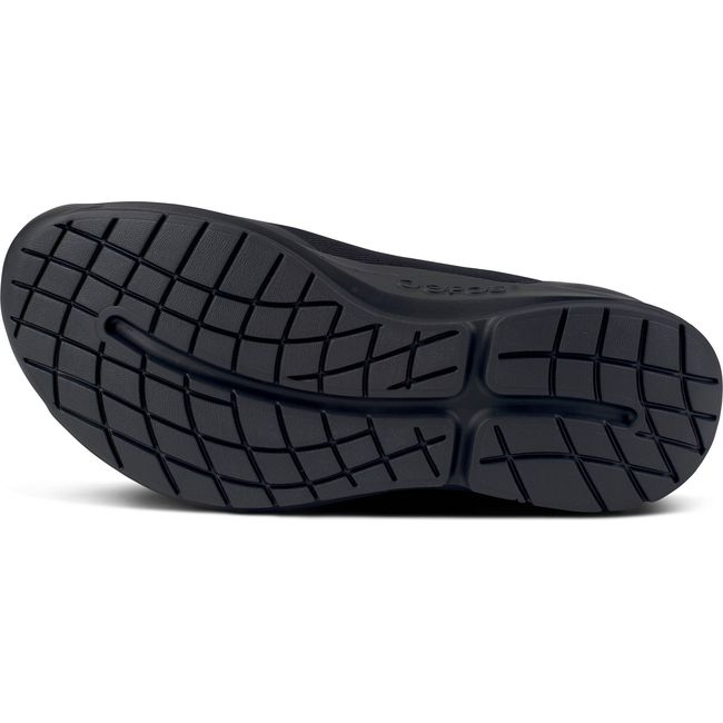 Sole of lace up Men&#39;s OOFOS OOmg Sport LS Shoe in black mesh upper with a black sole