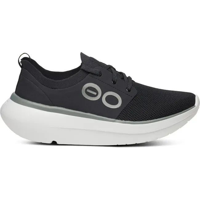 Lateral side of Men's OOfos OOmy Stride Shoe in black and white