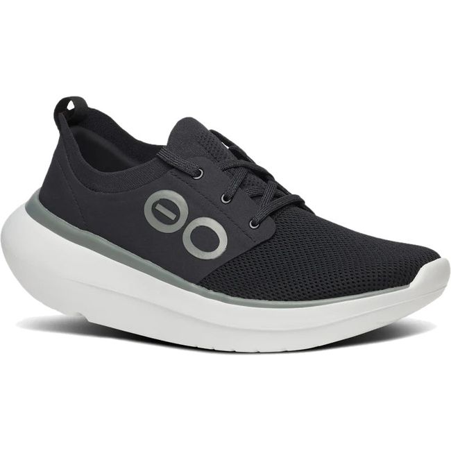 Front angled view of Men's OOfos OOmy Stride Shoe in black and white