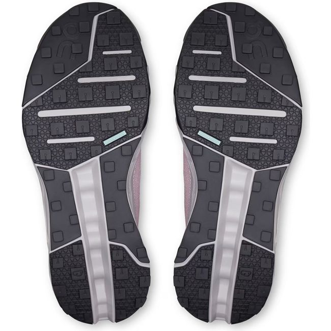 Soles of Women's On Running Cloudhorizon Trail Running Shoes in Mauve Fade Pink with black grip