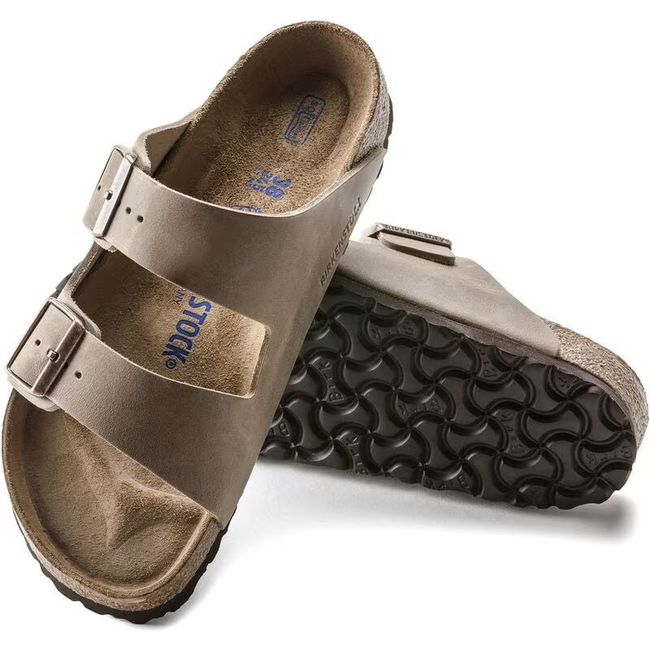 Pair of Tobacco brown Birkenstock Arizona Soft Footbed Sandals showing the sole and leather upper