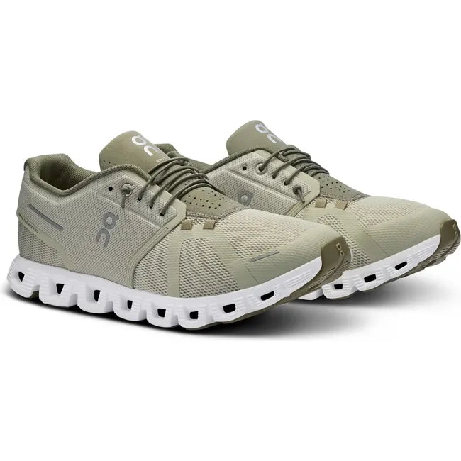 Pair side of On Cloud 5 running shoes in light green with a white sole and slip on lacing