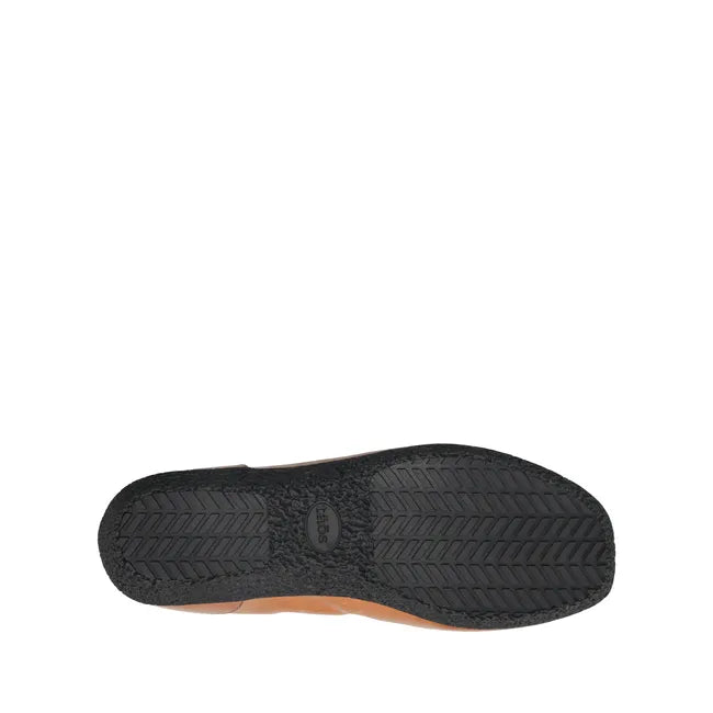 Sole of Women&#39;s Taos Flat Chit Chat in caramel brown leather with black rubber tread
