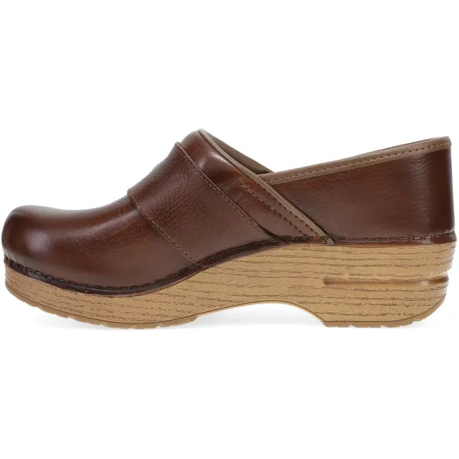 Dansko Pearson clog in brown waxy milled leather, side profile showing rocker bottom
