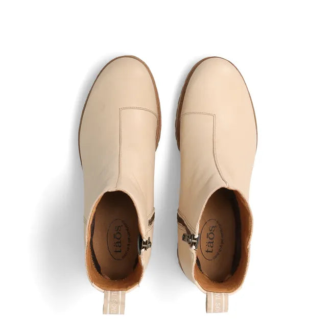 Top down view of Women's Taos Downtown Boot in ivory leather with cork midsole and side zipper
