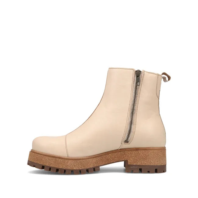 Medial side of Women's Taos Downtown Boot in ivory leather with cork midsole and side zipper