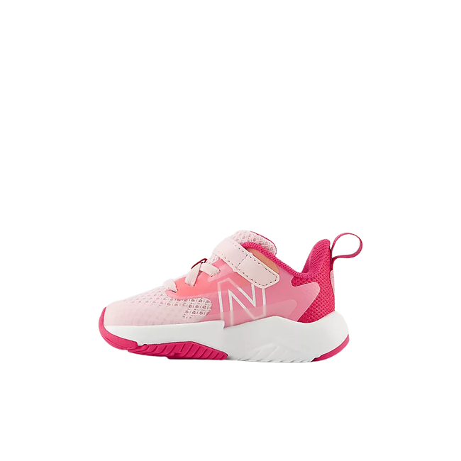 Medial side of New Balance Kids' Rave Run V2 Bungee Lace Top Strap Running Shoe (Infant/Toddler) in Rose Sugar