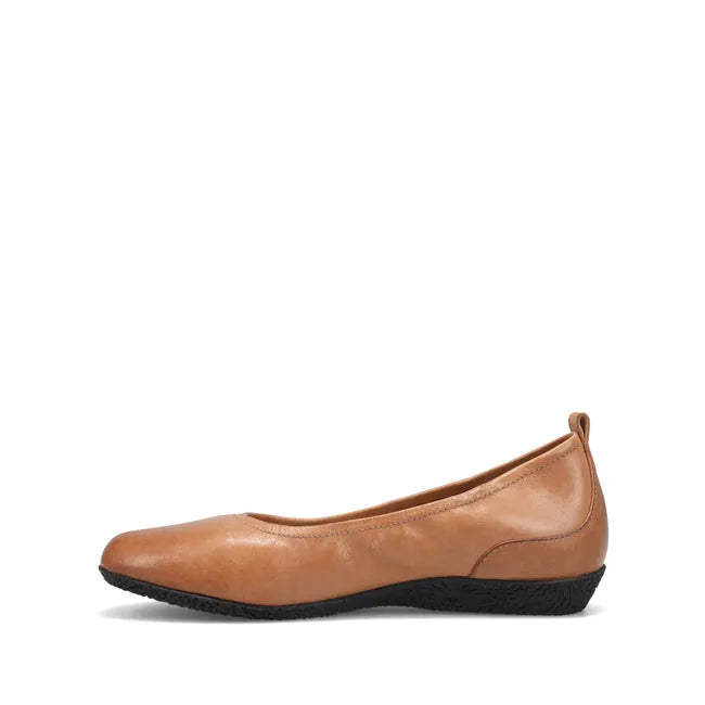 Medial side of Women&#39;s Taos Flat Chit Chat in caramel brown leather