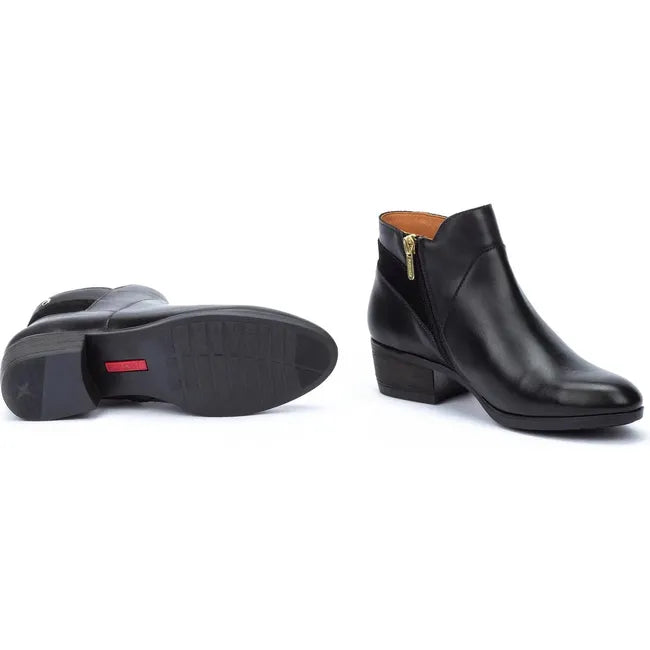 Pair of Women's Pikolinos Daroca Ankle Boot in black leather showing the side zipper and rugged sole