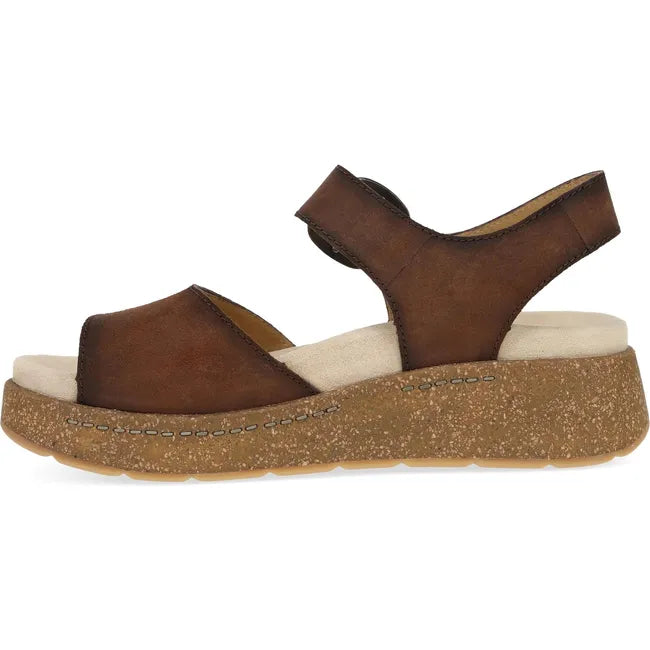Medial side of Women's Dansko Bianca Sandal in brown suede with cork platform sole