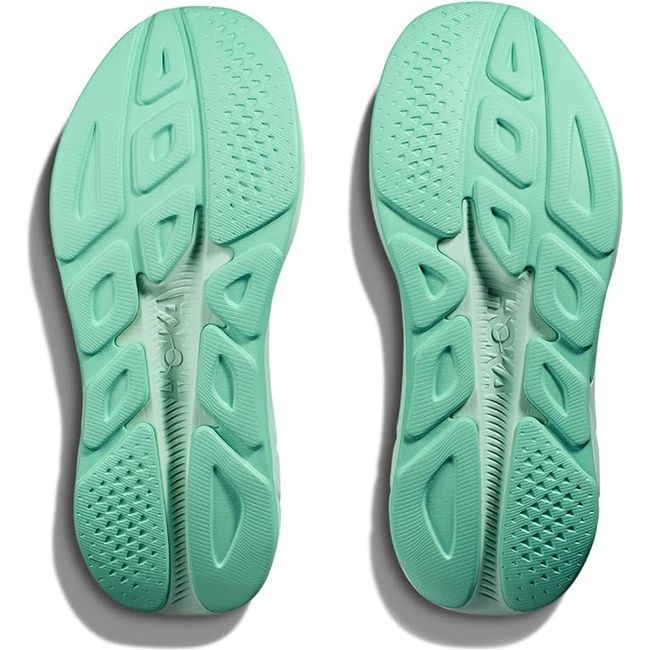 Soles of Women's Hoka Rincon 4 Running Shoes in Seafoam Electric Aqua tread color