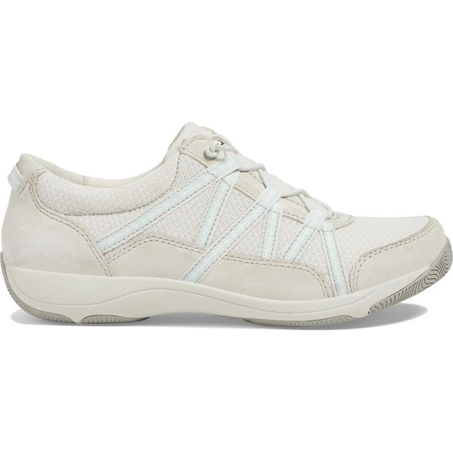 Lateral side of Women's Dansko Harlyn Sneaker in ecru suede with elastic laces