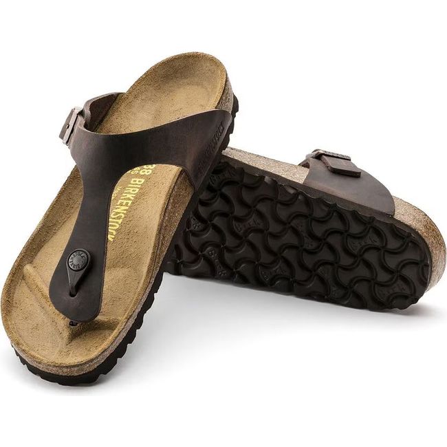 Upper and sole of Birkenstock Unisex Gizeh Oiled Leather Sandals in Habana Brown