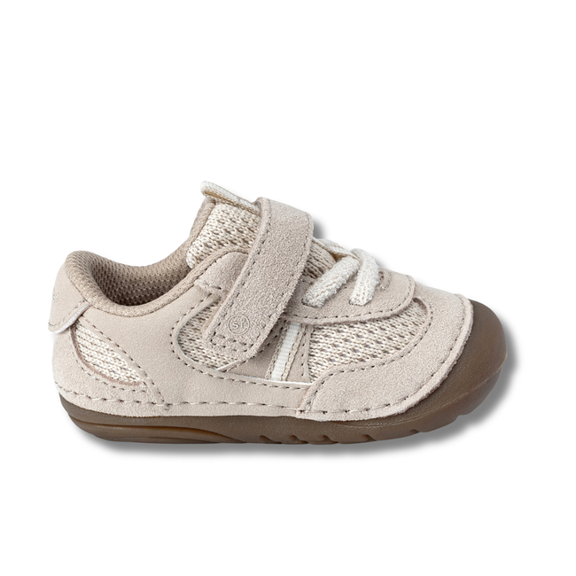 Lateral side of Stride Rite Kids' Soft Motion Jules Sneaker in Toffee Beige with velcro strap